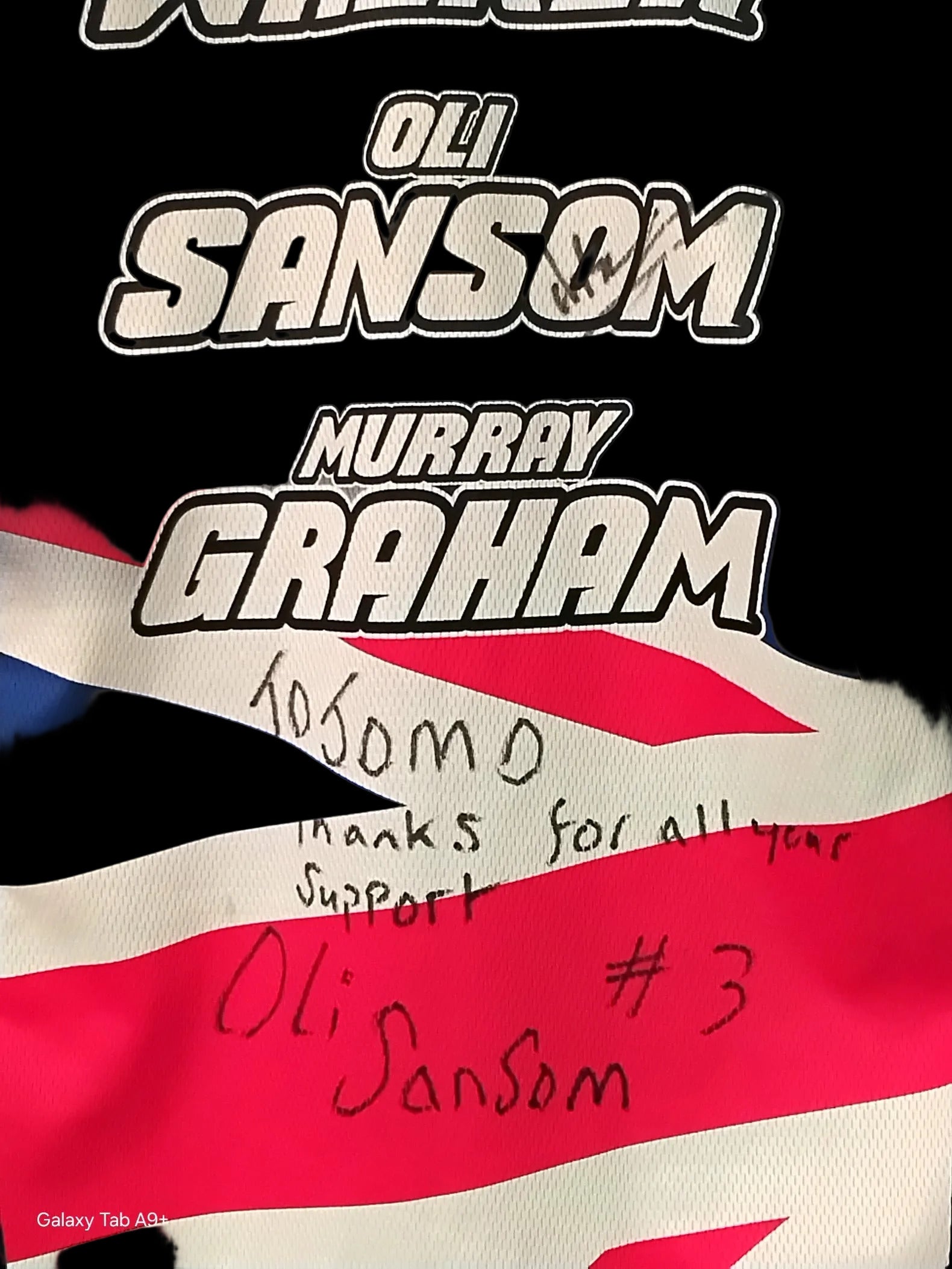 Flag with names Oli Sansom and Murray Graham and a message of thanks.