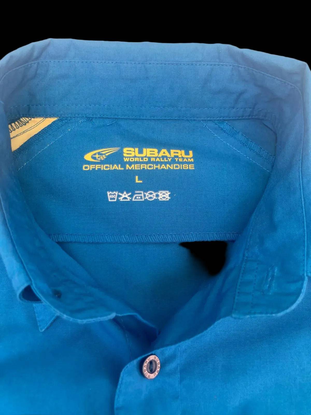 Subaru World Rally Team official merchandise label inside blue shirt