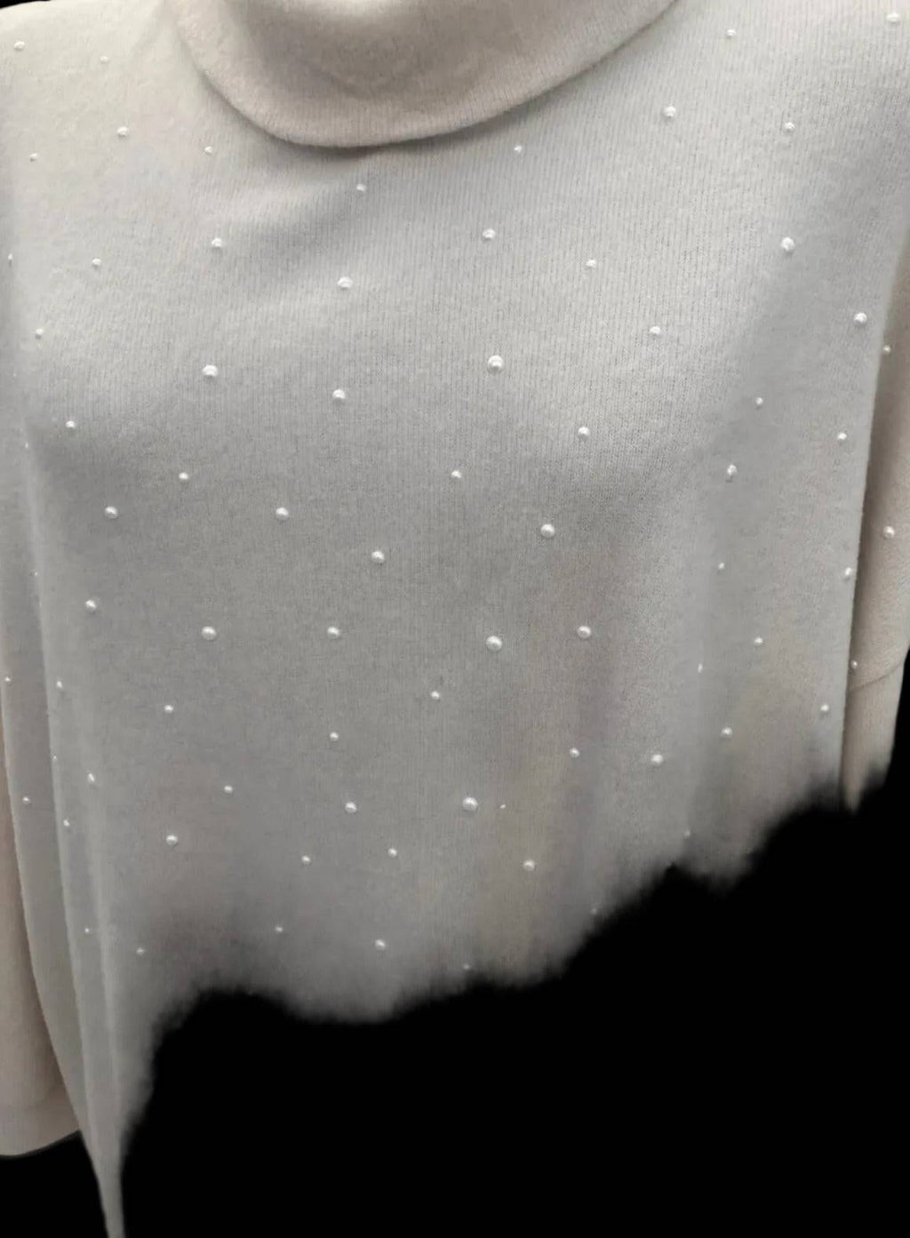 White dress with pearl embellishments and textured fabric