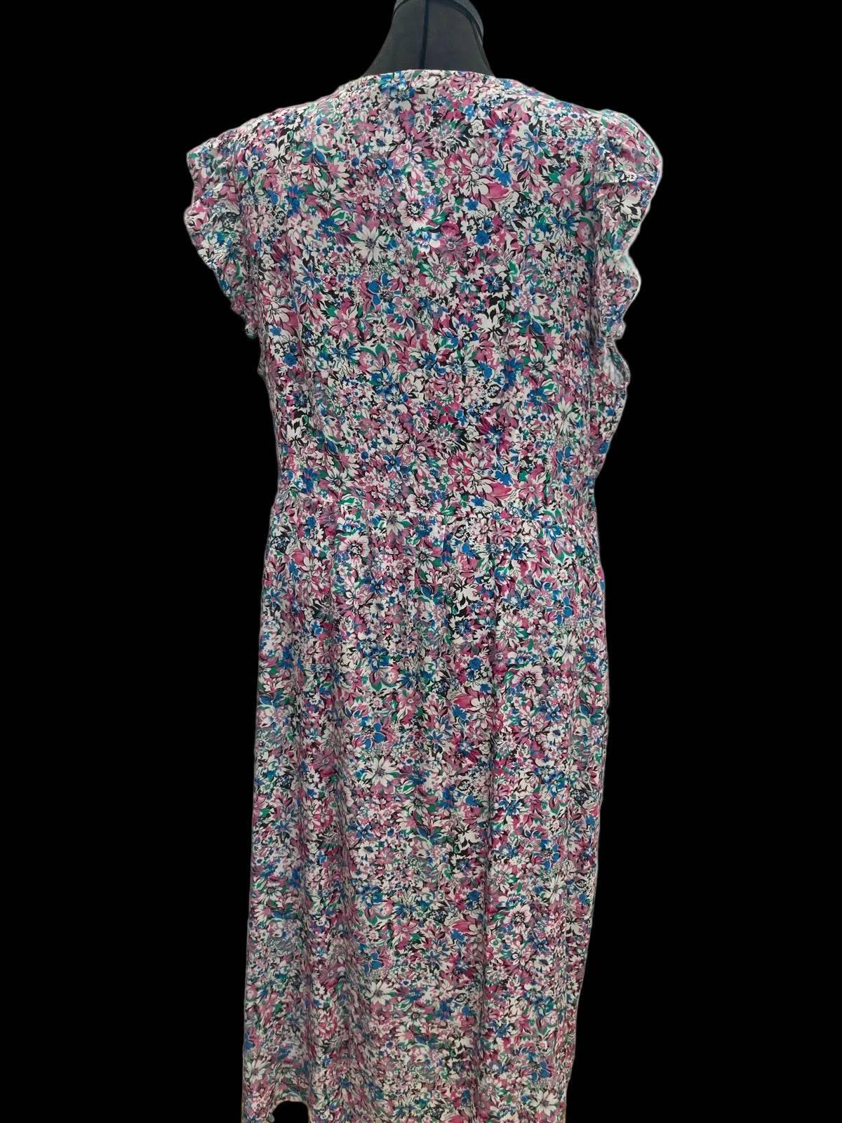 Side view of floral wrapover dress on mannequin