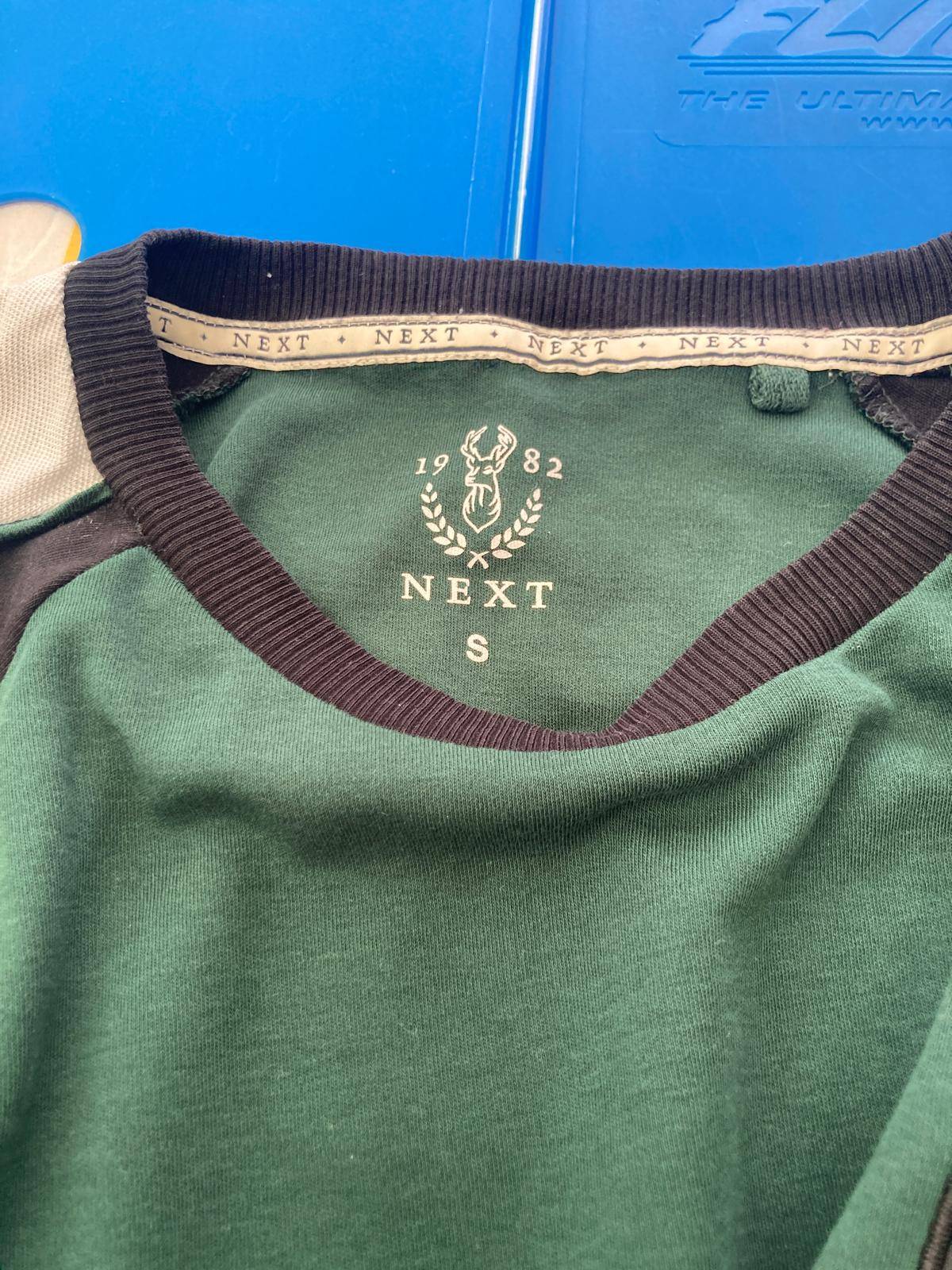 Close-up of T-shirt collar with brand label