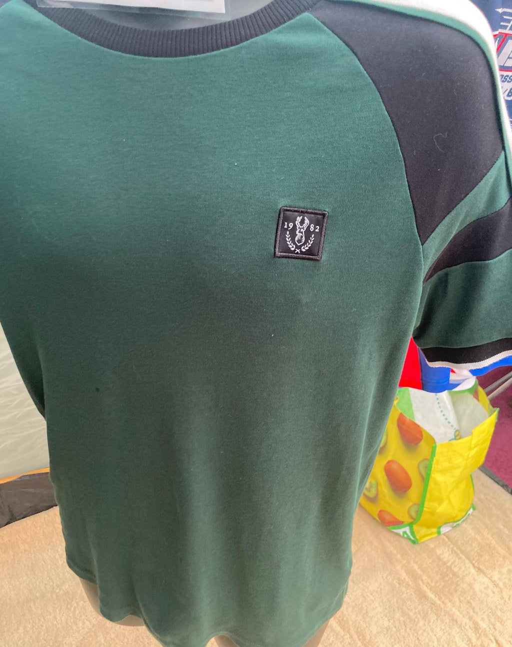 Men's green T-shirt with logo inside collar