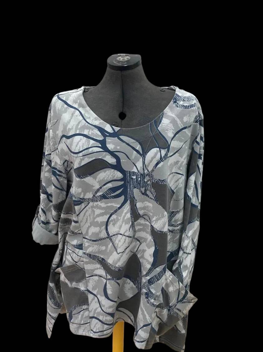 Abstract patterned top with pockets and flared silhouette