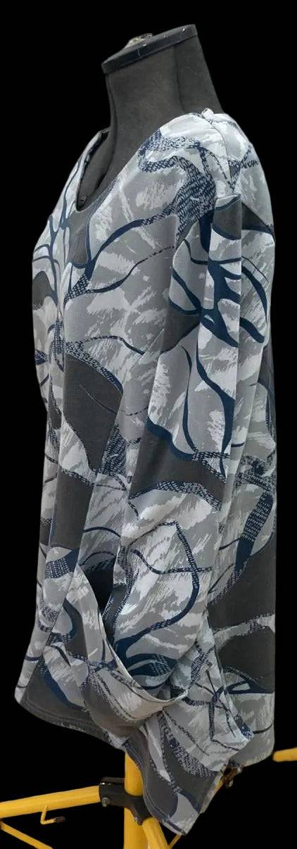 Long sleeve abstract patterned top with pockets and rolled cuffs