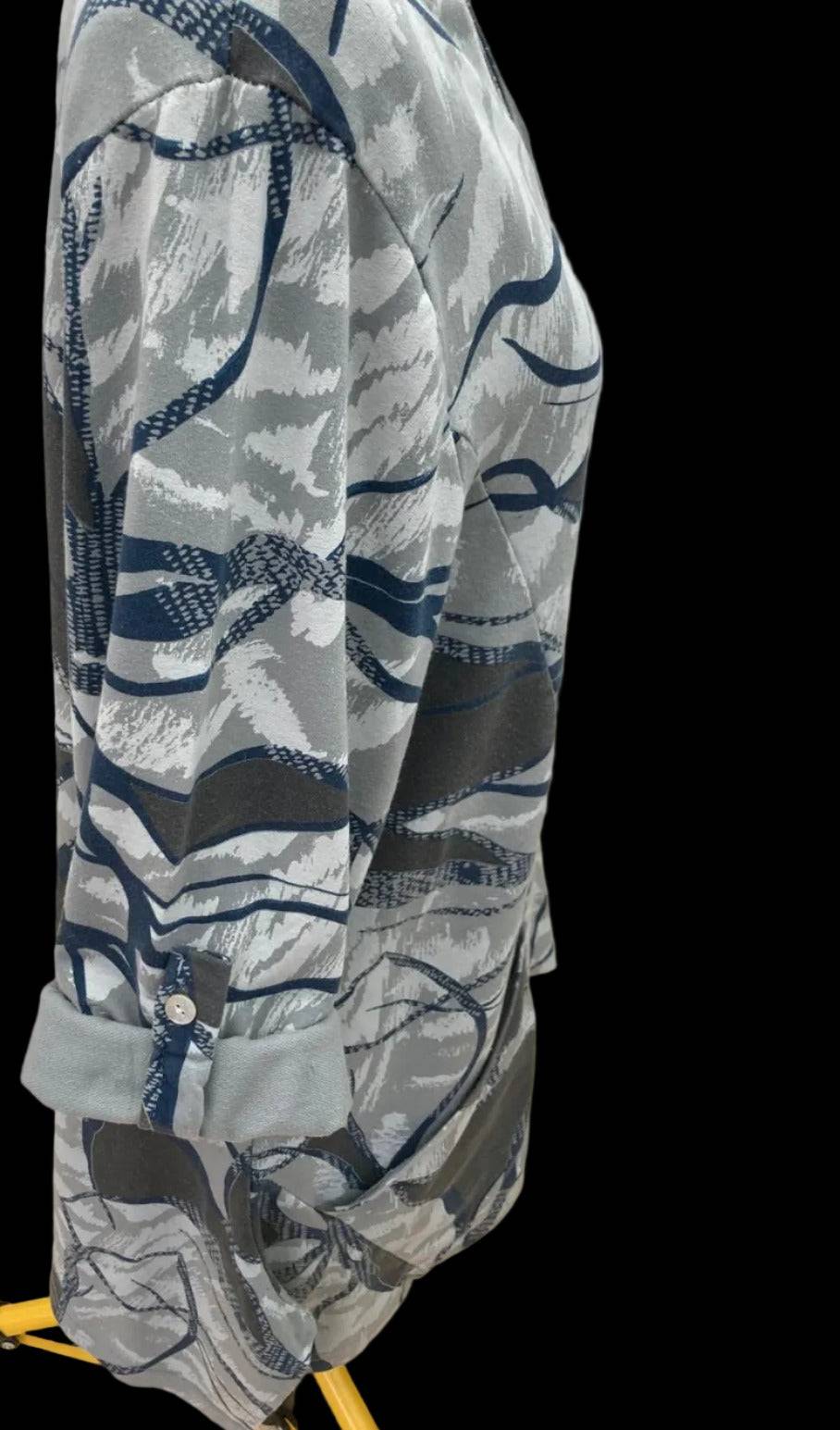 Side view of trendy abstract print top with relaxed fit