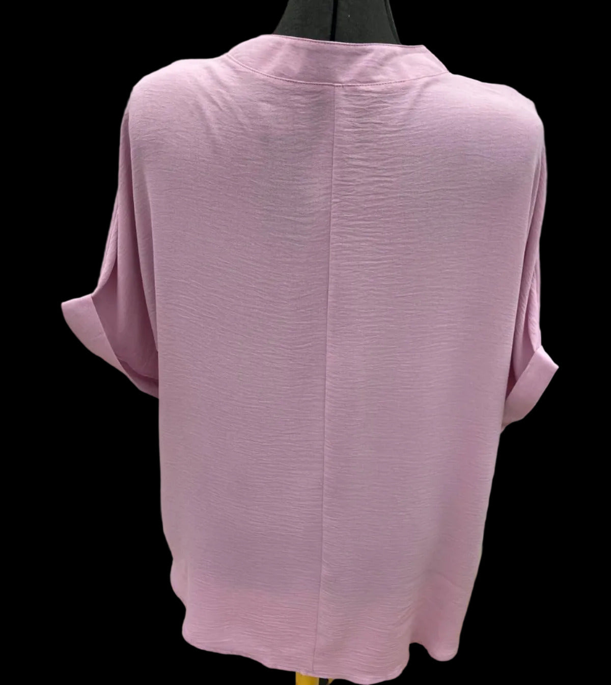 Back view of pink tunic blouse with relaxed fit