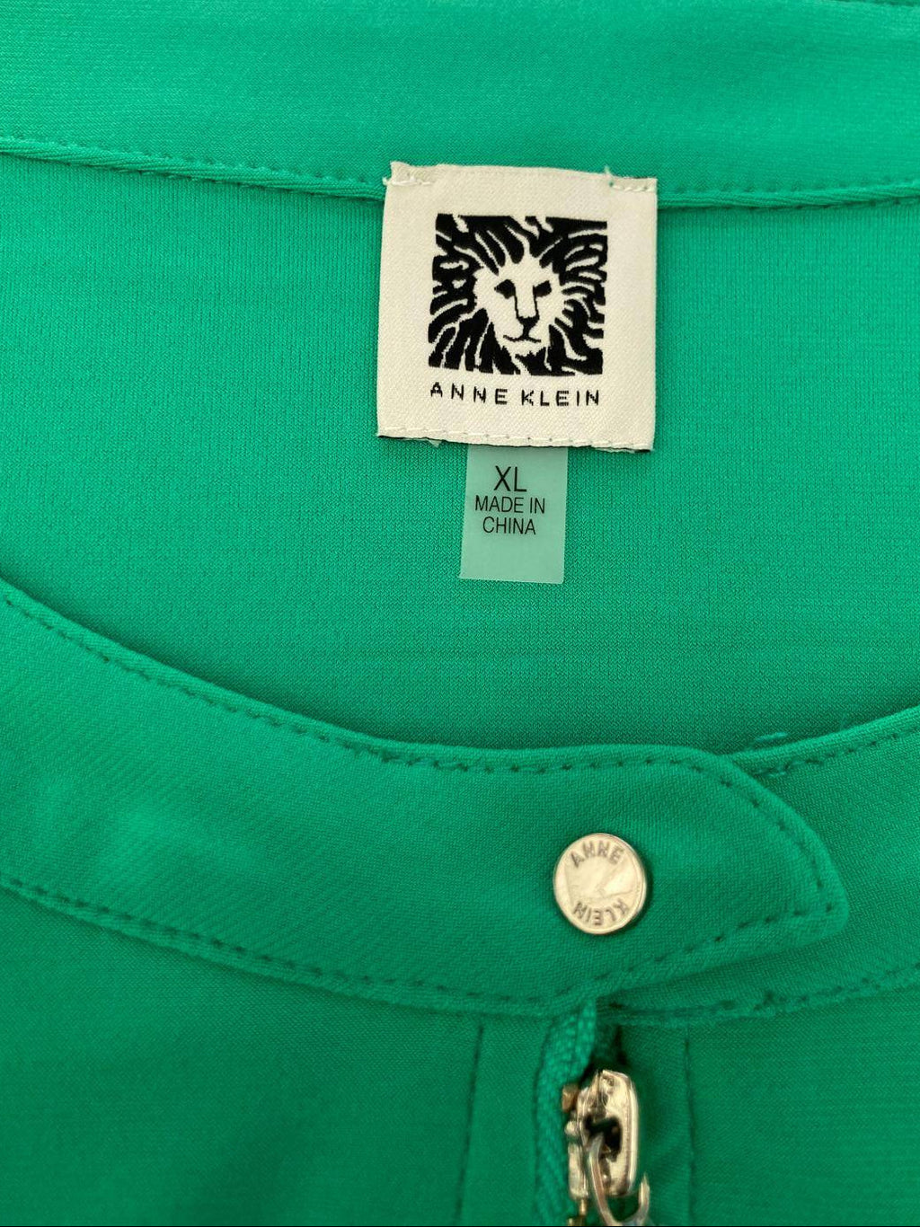 Anne Klein green blouse label with size XL and zipper detail