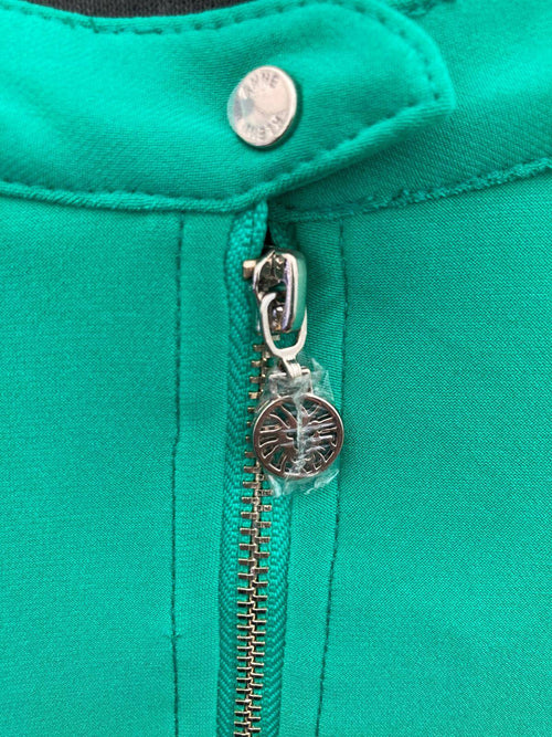 Close-up of turquoise fabric and silver zipper on Anne Klein blouse