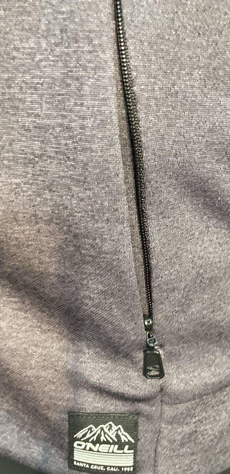 Close-up of O'Neill logo on zip-up jacket