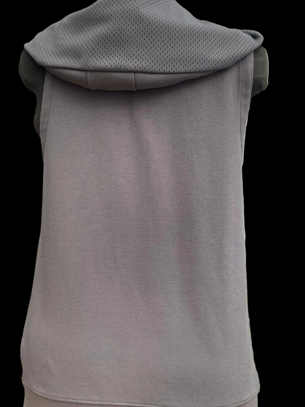 Back view of gray sleeveless hoodie with zippered side pocket for versatile style