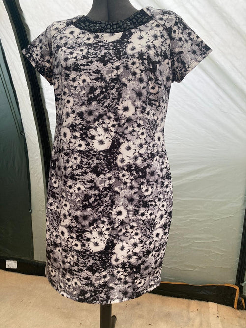 Floral dress with short sleeves on mannequin