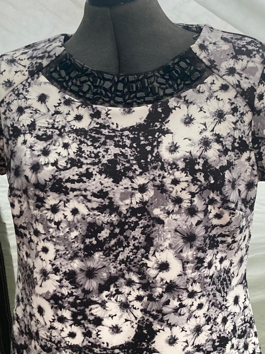 Side view of floral dress with zipper detail