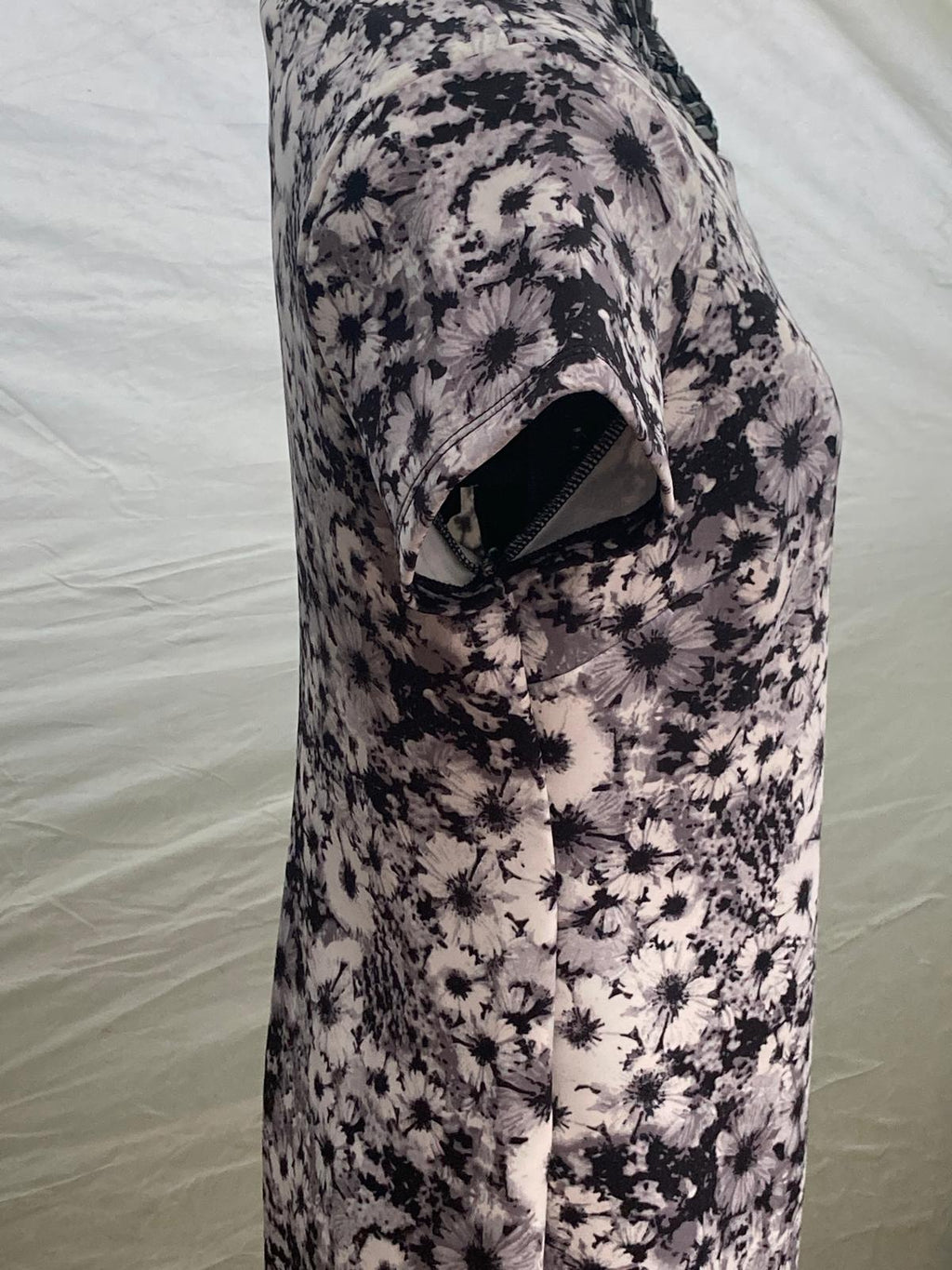 Close-up of floral dress fabric with black and white flowers