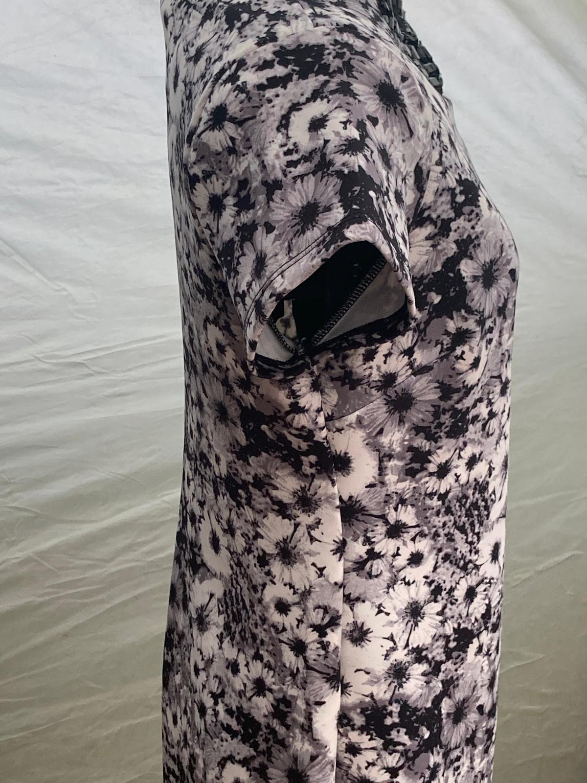Close-up of floral dress fabric with black and white flowers