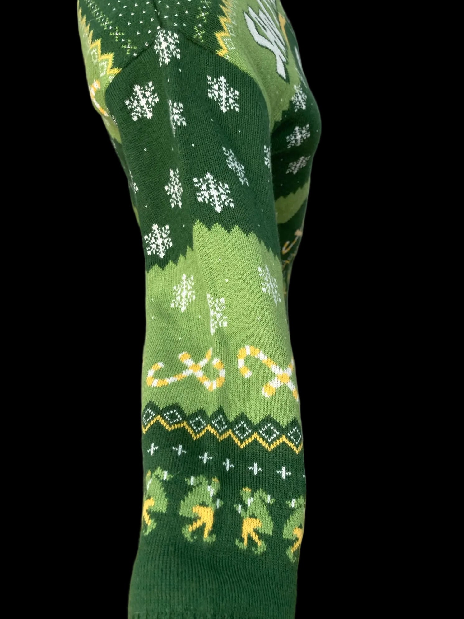 Close-up of festive sweater with snowflake and reindeer patterns